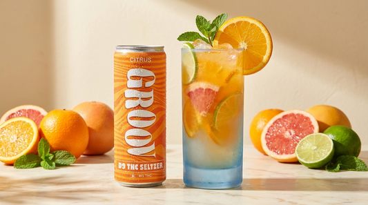 GROOV Citrus THC seltzer beside a bright citrus fizz mocktail