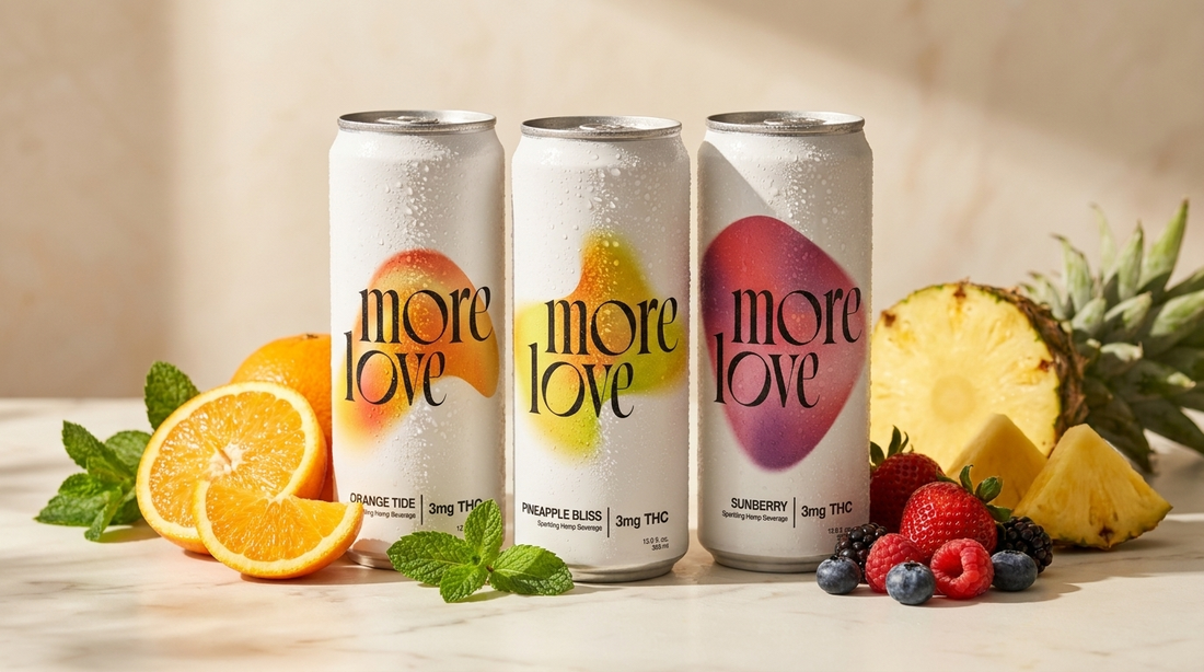 Three More Love THC seltzer cans - Orange Tide, Pineapple Bliss and Sunberry - with fresh fruit